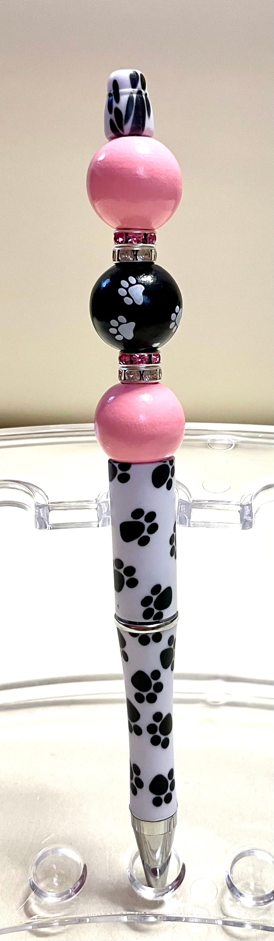 White/black paws w/ pink beads