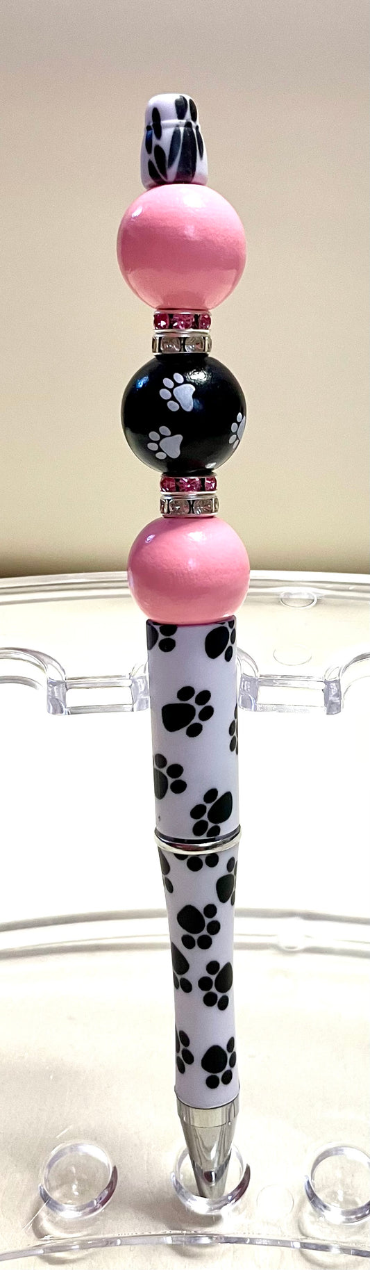 White/black paws w/ pink beads